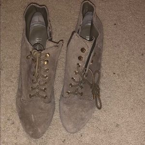 Tie up INC bootie with a zip and gold hardware